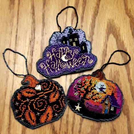 three flat Halloween ornaments
