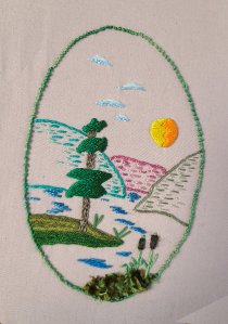 small landscape embroidered in mixed threads