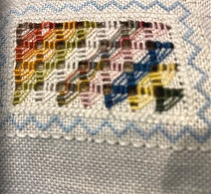 abstract, multi-coloured needlework