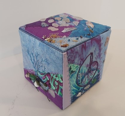 fabric covered box in blues/purples
