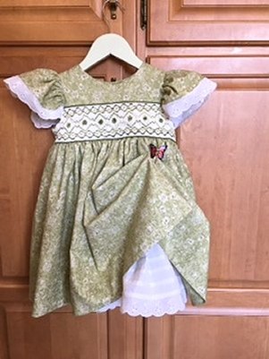 front view of smocked, green dress