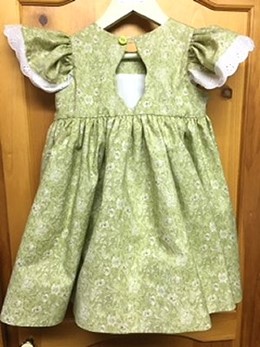 back view of smocked, green dress