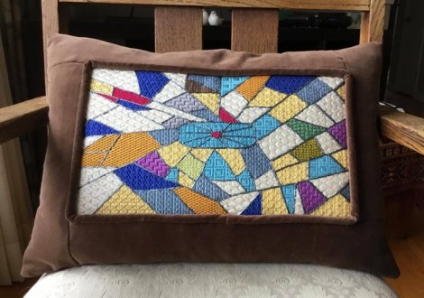 canvas work pillow with crazy quilt theme