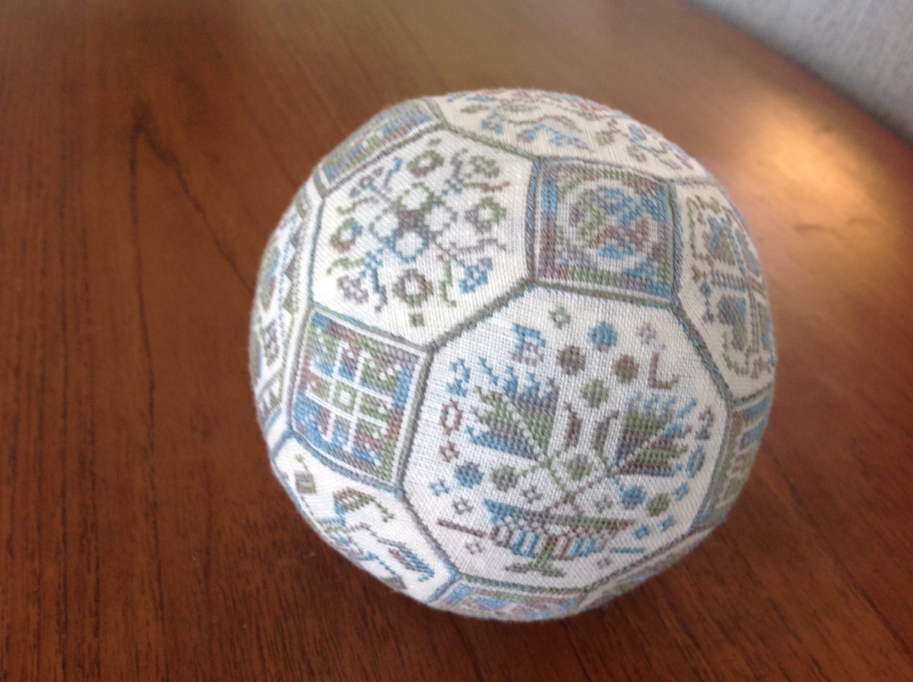 cross-stitched ball with classic designs