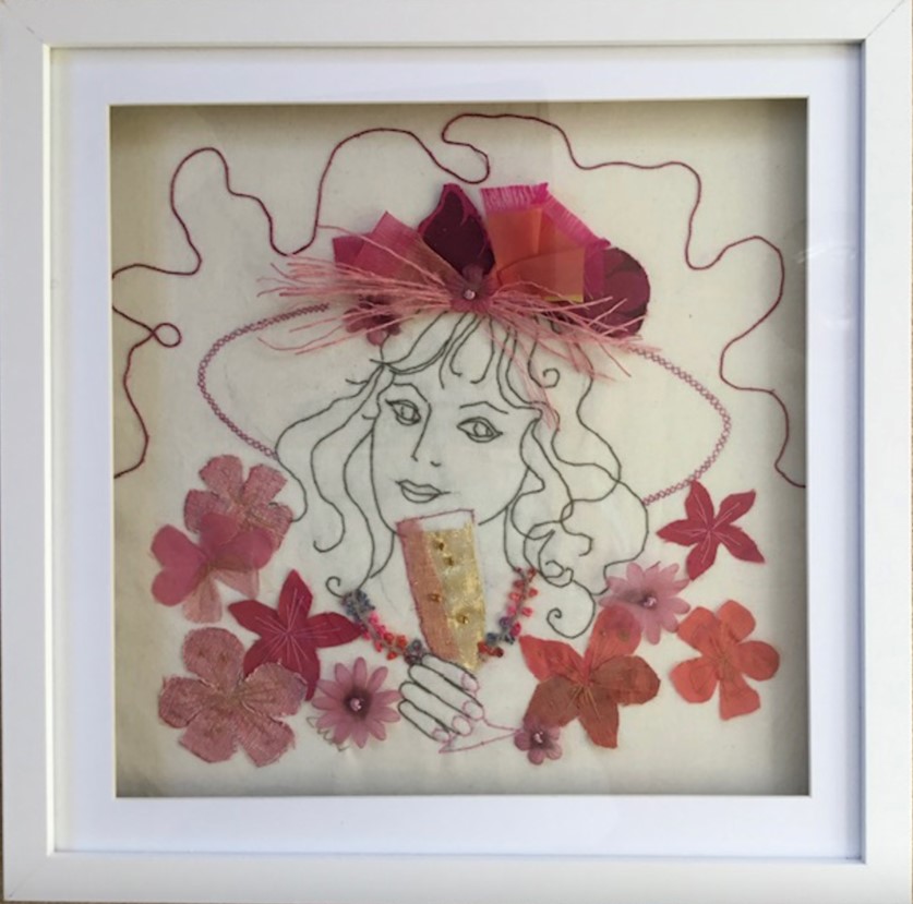 embroidered image of woman with applied silk flowers