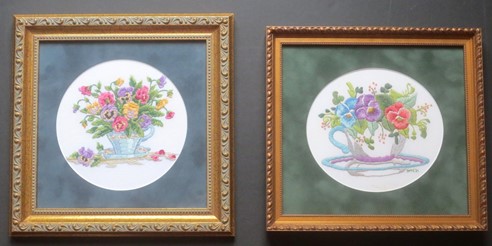 2 framed embroideries of pansies