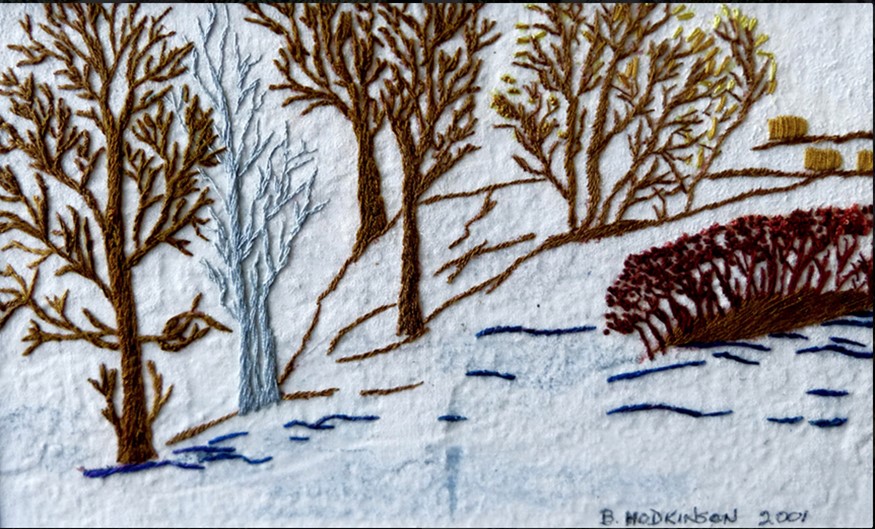 leafless winter trees against snow