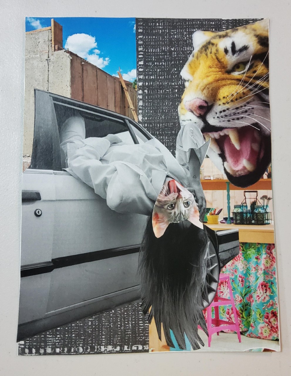 cat headed figure in a white suit observed by a tiger