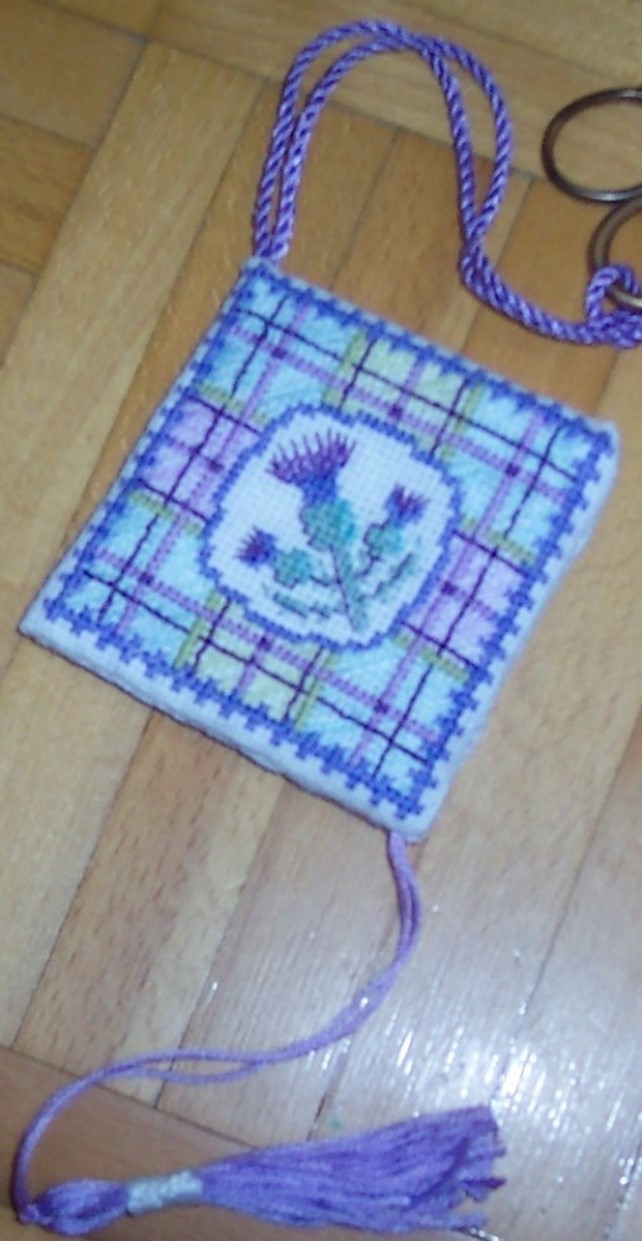 cross stitched thistle in purples