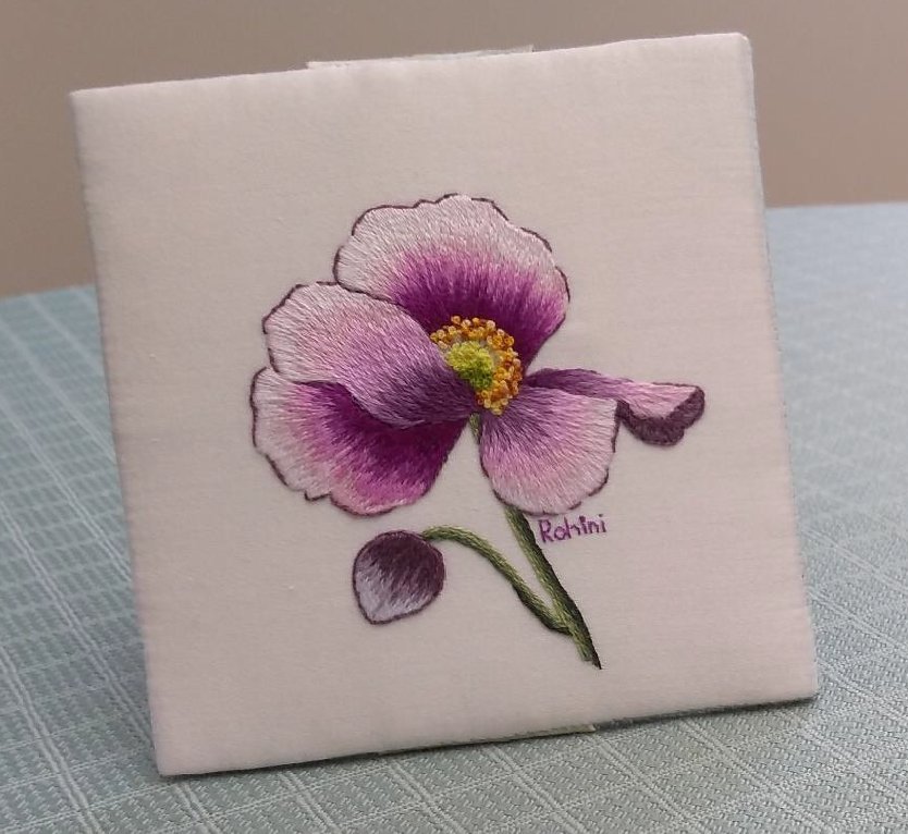 thread painted flower in purple and pink