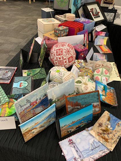 close shot of a table full of embroideries