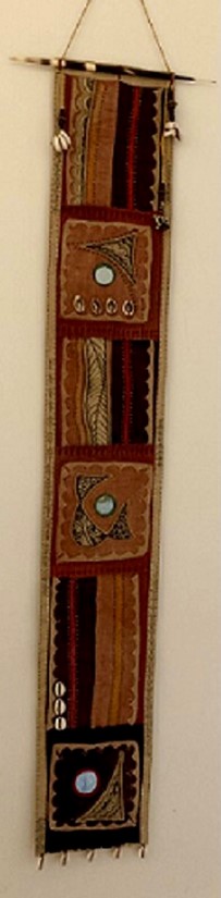 long embroidery in brown tones