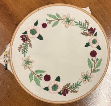 crewel work flowers in a wreath shape