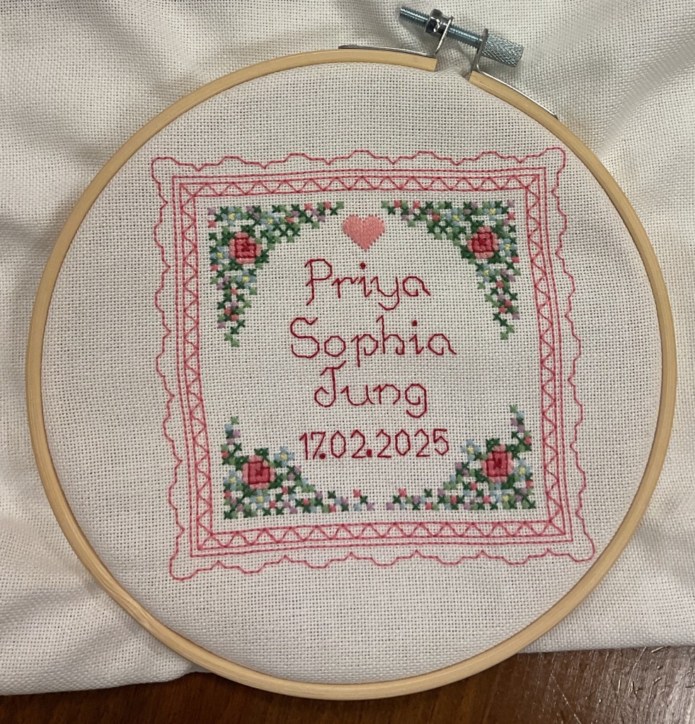 cross-stitch in pinks