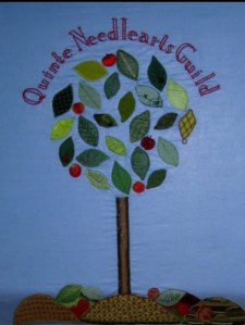 hand-stitched tree and logo