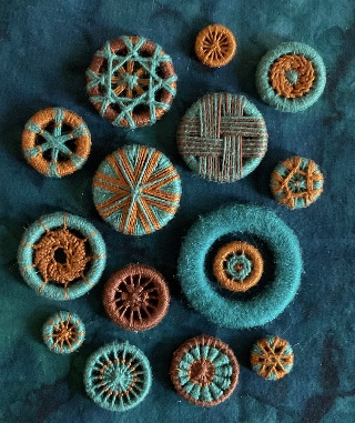 14 Dorset buttons in orange and turquoise