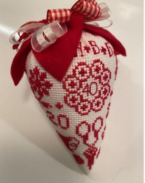 cross-stitched sampler as a stitching "strawberry"