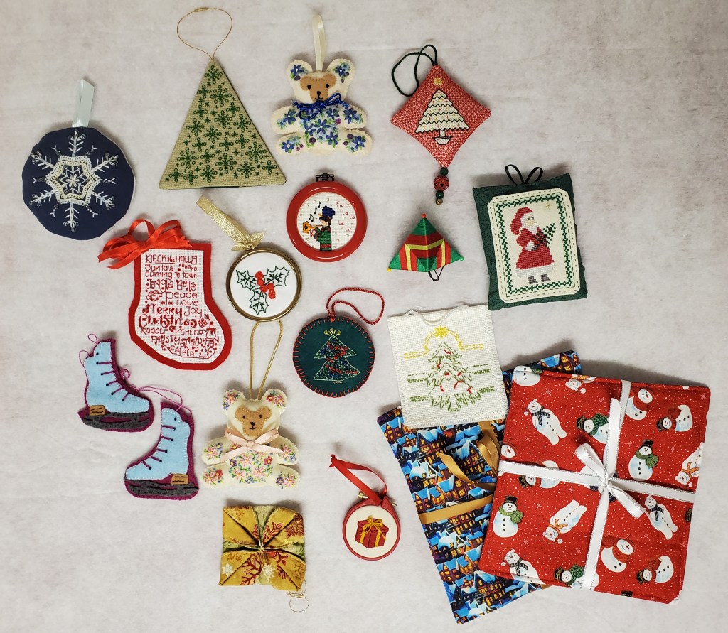 15 stitched Christmas ornaments in various styles