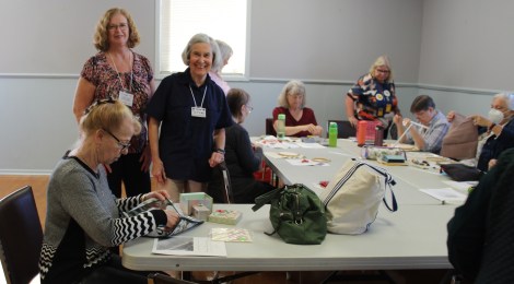 a group of stitchers attending a class