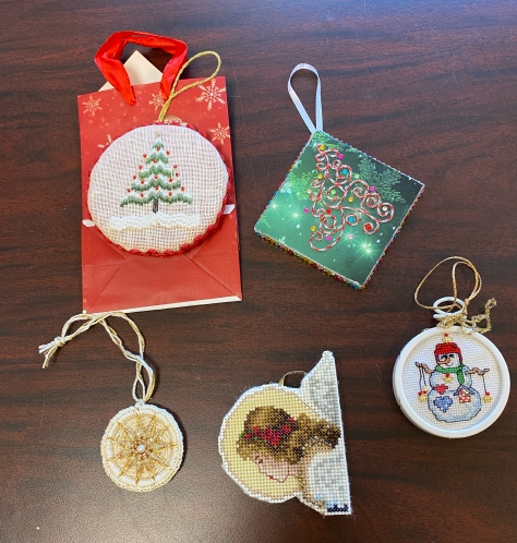 hand-stitched Christmas ornaments on a table