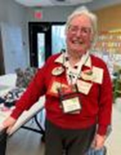 a woman wearing 5 name tags