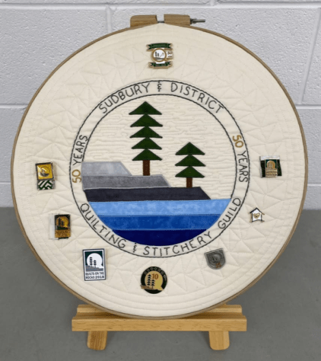 SDQSG 50th anniversary "banner" in a large embroidery hoop