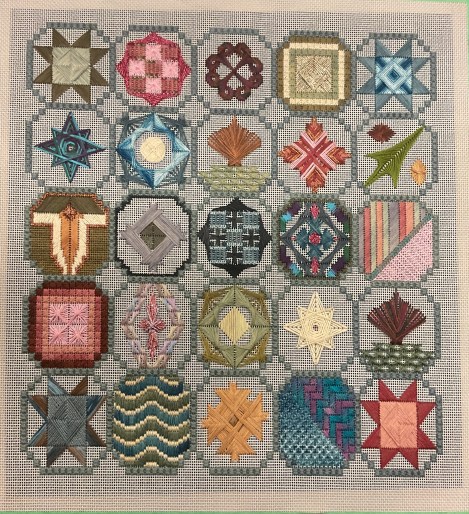 canvas work sampler with circlular motifs, each one different