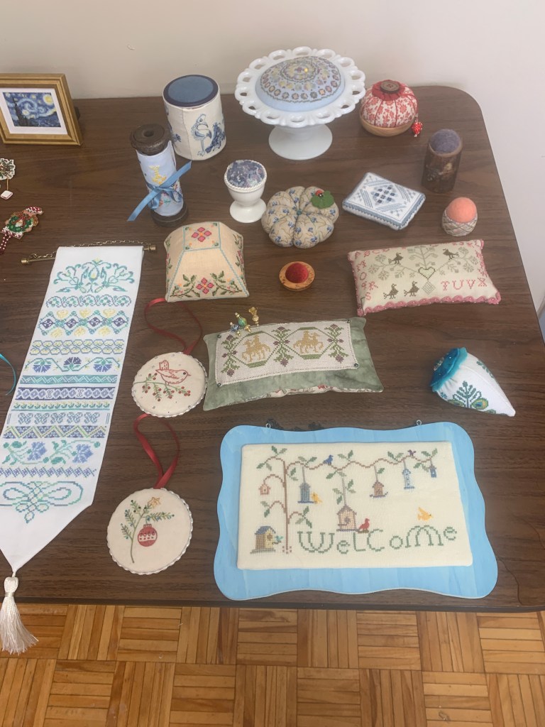 a table full of pincushions and other small projects