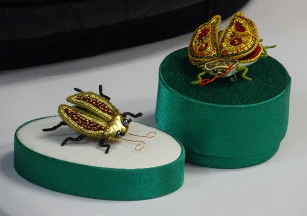 2 free-standing goldwork beetles