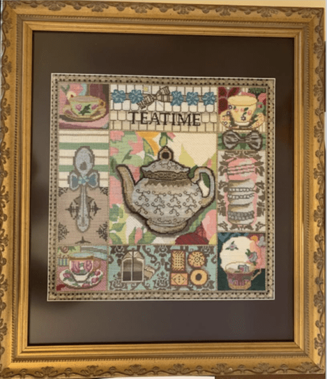 cross-stitch work featuring and teapot and cups