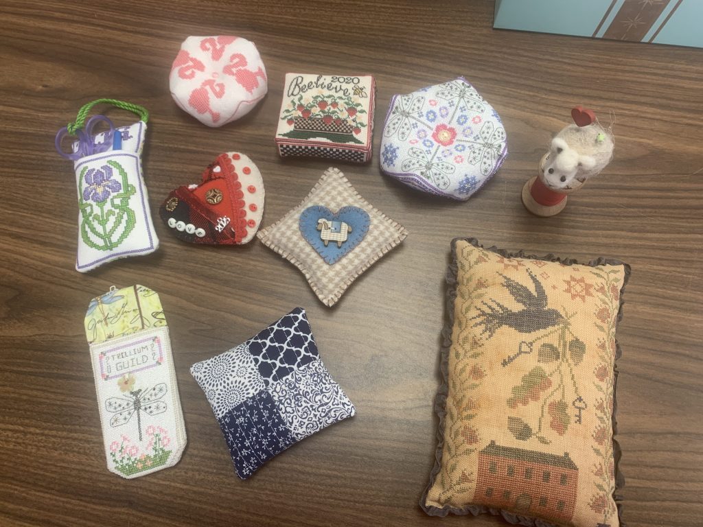 a table with several pincushions