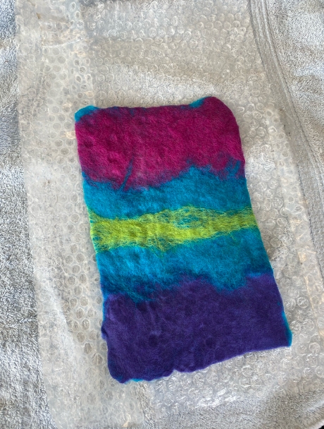 handmade felt in bands of pink, blue, yellow fleece